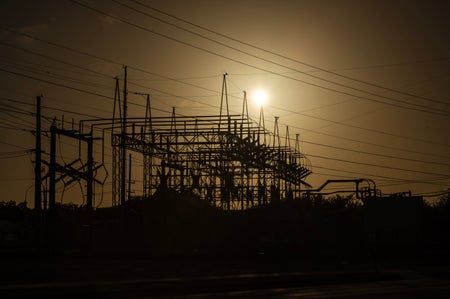 Power lines with glowing heat background