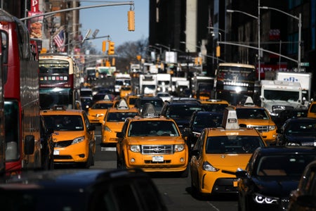 Traffic moves along 7th Avenue in Manhattan, January 25, 2018 in New York City