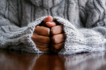 Close-up of woman's hands on table