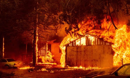 A home is engulfed in flames.