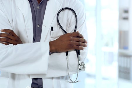 Shot of an unrecognizable doctor standing with arms crossed holding stethoscope