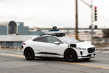 A Waymo autonomous vehicle on Cesar Chavez Street in San Francisco.